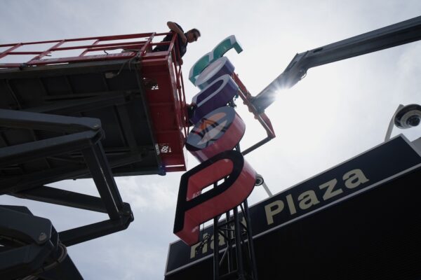 Mo Pop Festival custom sign installation process at Hart Plaza in Downtown Detroit.