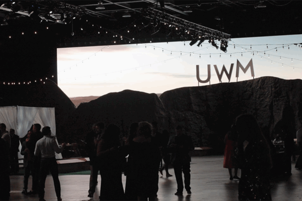 Corporate party with a large custom fabrication mountainside with company logo on the top like the Hollywood sign