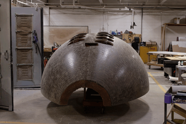 Custom Fabrication in progress of massive football-shaped disco balls for Uber's Super Bowl LIX Party