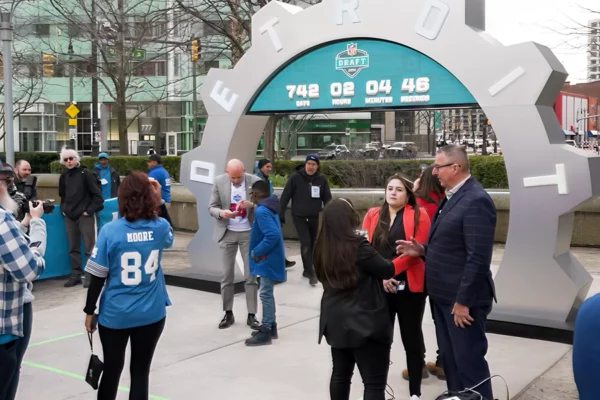 Crowd gathering around the NFL Draft countdown clock at 742 days during the unveiling event in downtown Detroit