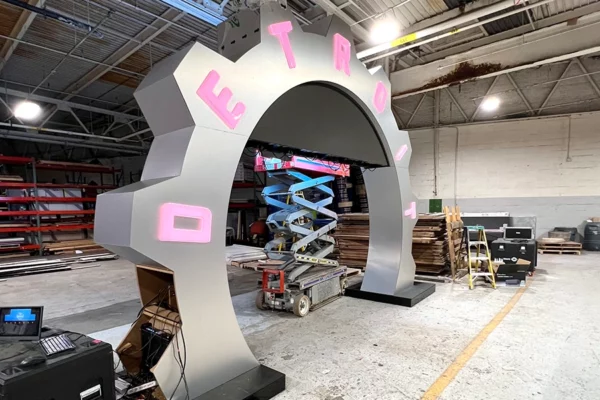 NFL Draft countdown clock arch with pink lit letters and LED screen powered on during pre-production testing at Display Group