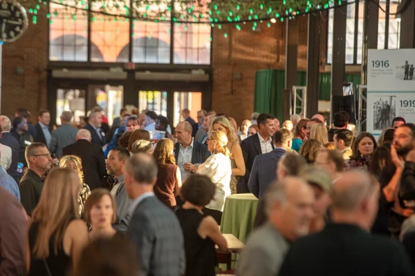 Wide shot of party guests commingling