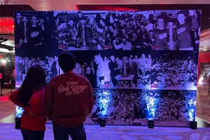 fans looking a mural at the Hockeytown Centennial special event