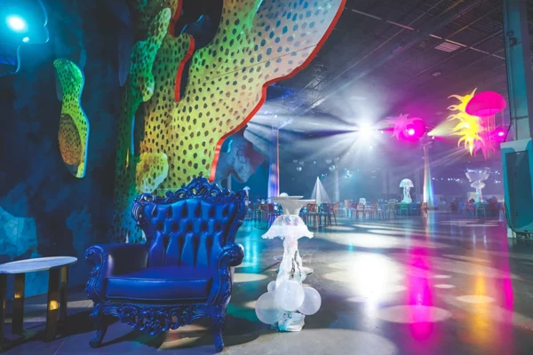 Underwater themed UWM holiday party with jellyfish décor and lounge seating
