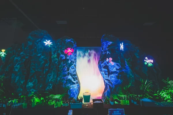 Blue Lagoon bar with waterfall backdrop at UWM holiday party