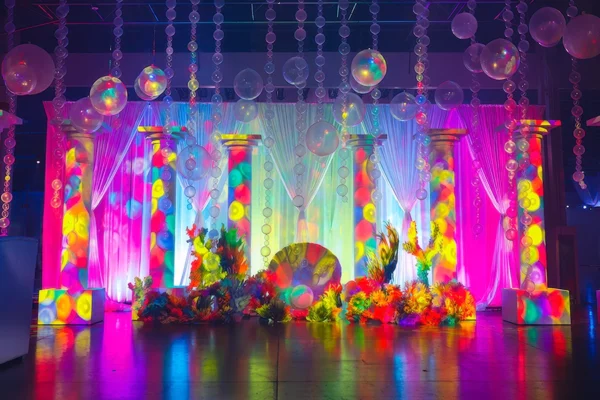 Colorful underwater stage set with bubble installations at UWM holiday party