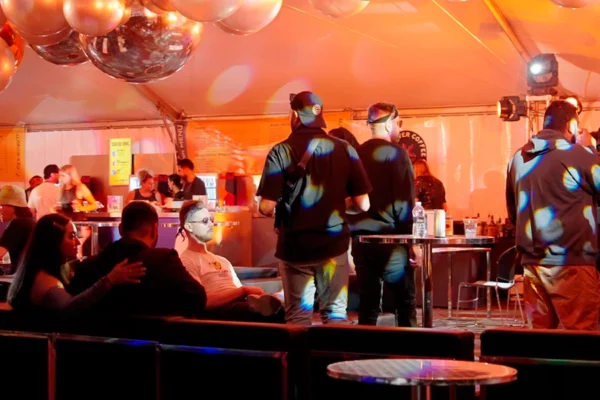 Attendees in the VIP tent at night