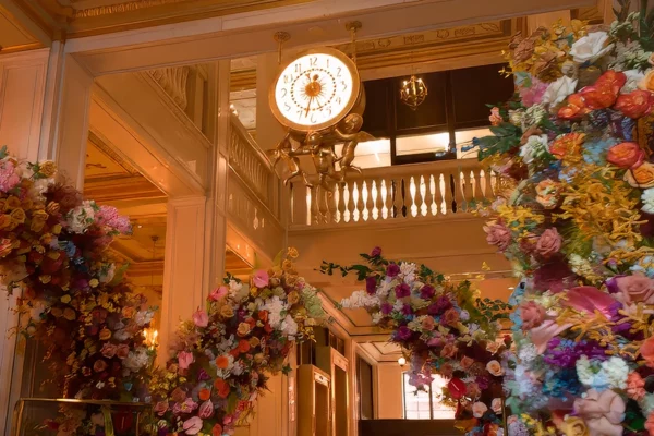 Floral arch installation framing Book Tower interior staircase