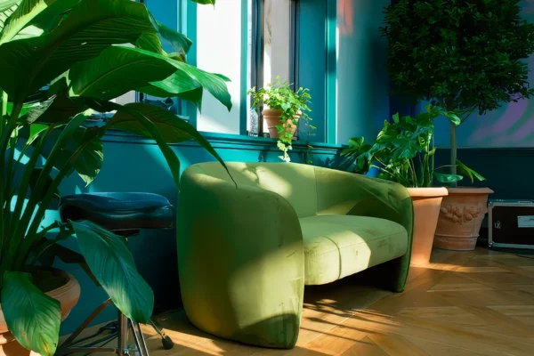 Custom lounge seating and tropical plants inside Book Tower lobby