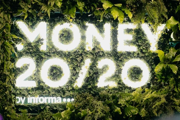 Money 20/20 illuminated logo sign on living green wall