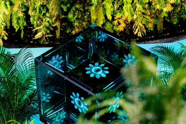Money 20/20 AI experience cube with teal geometric light patterns