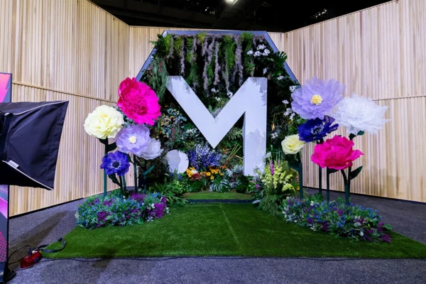 Money 20/20 floral photo installation with oversized M logo