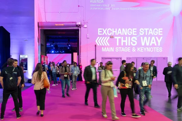 Money 20/20 expo corridor with Exchange Stage directional signage