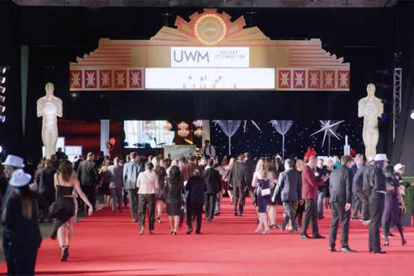 UWM Holiday Celebration entrance with marquee arch and red carpet