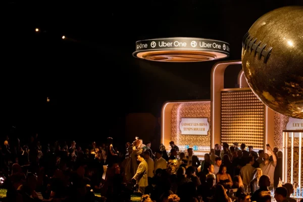 Uber One outdoor Super Bowl party bar and gold football installation