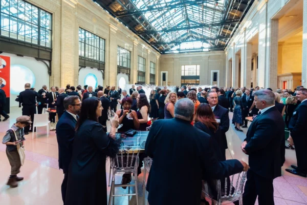Cocktail hour crowd inside Michigan Central Station atrium at AHOF gala